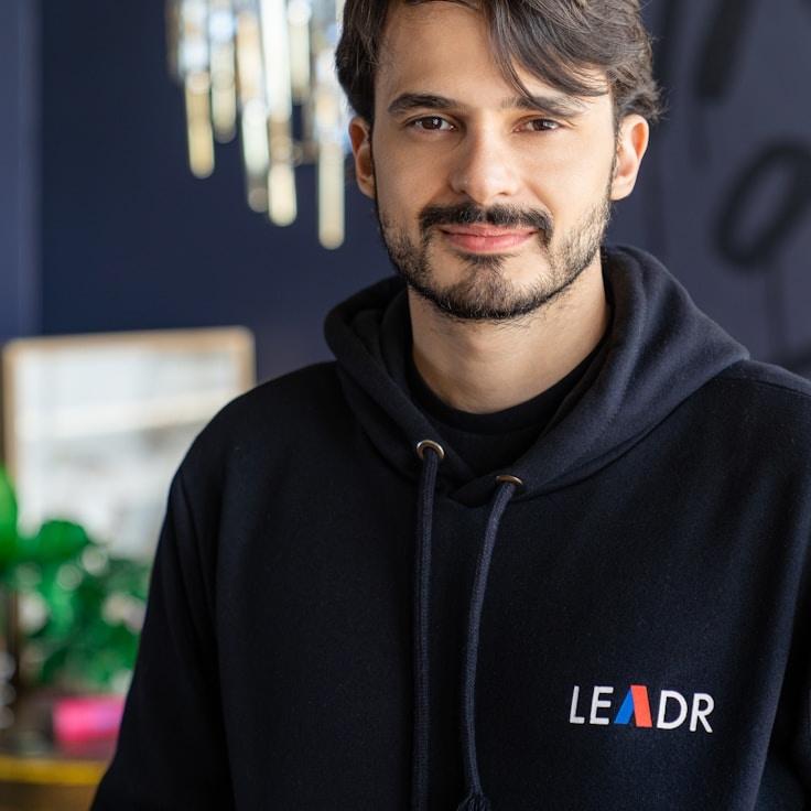 A. Patel, Lead Design Curator at PulseQuietVertex, reviewing corporate floral arrangements